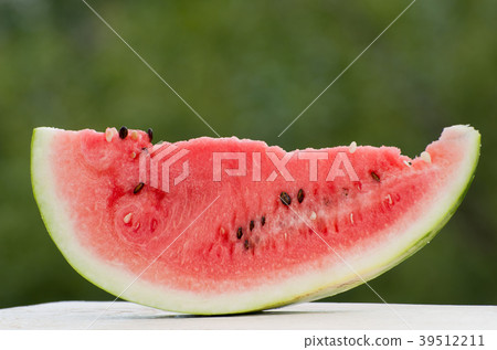 Large slice of watermelon outdoors Large slice of watermelon outdoors 39512211