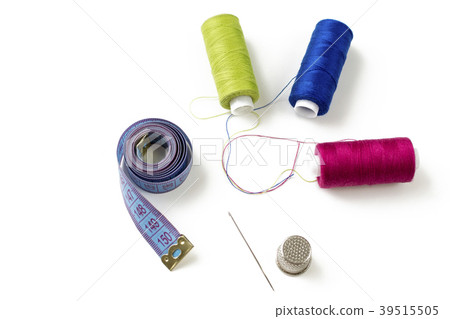 Sewing accessories and threads on white, top view Sewing accessories and threads on white, top view 39515505