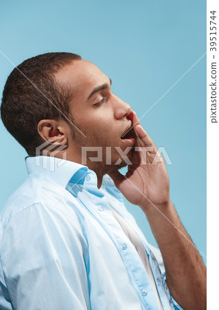Sad Afro-American man is having toothache. against 39515744