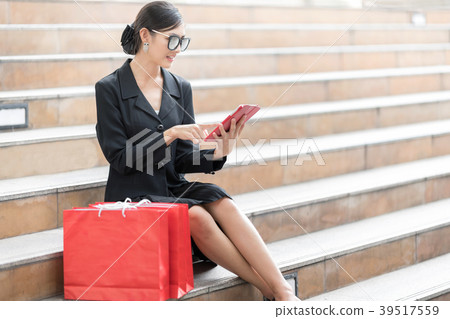 Woman With Lot of Red Shopping Bags.  39517559