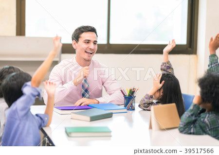 Happy Children and Teacher in Learning Class. 39517566