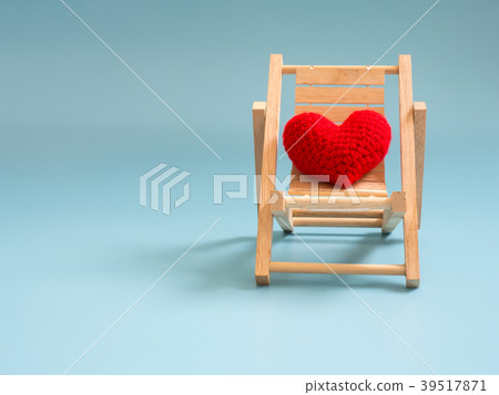 yarn red heart on the wooden beach chair on blue yarn red heart on the wooden beach chair on blue 39517871