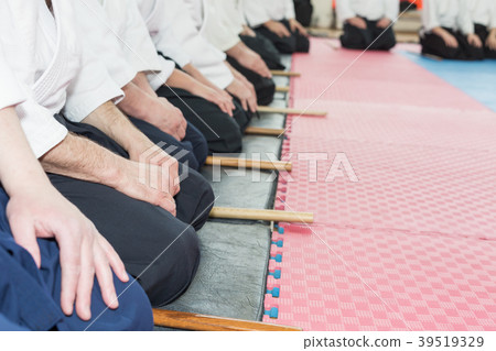 People in kimono on martial arts weapon training People in kimono on martial arts weapon training 39519329