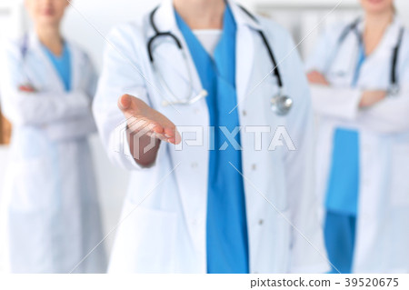 Group of medicine doctors offering helping hand Group of medicine doctors offering helping hand 39520675