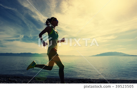 fitness sporty woman running on rocky seaside fitness sporty woman running on rocky seaside 39523505