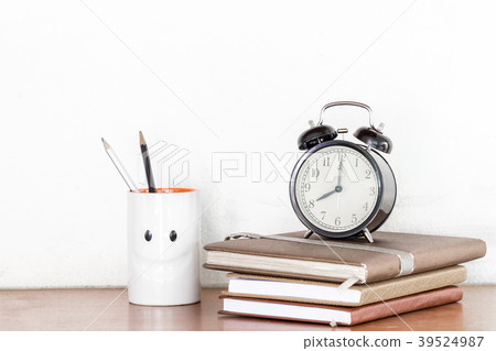 Back to school background with books and clock Back to school background with books and clock 39524987