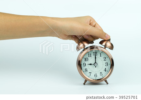 hands holding Vintage alarm clock hands holding Vintage alarm clock 39525701