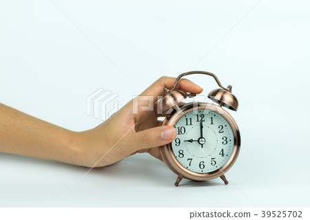 hands holding Vintage alarm clock hands holding Vintage alarm clock 39525702