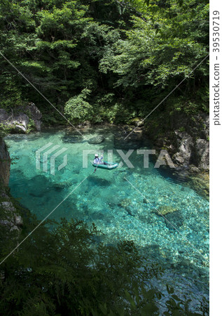 Pak craft floating in the clear stream 39530719