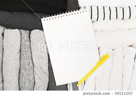 Packing of monochrome clothes in black suitcase Packing of monochrome clothes in black suitcase 39531207