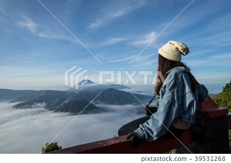 Young traveler looking at Mount Bromo volcano Young traveler looking at Mount Bromo volcano 39531268