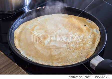French crepe, thin pancake on a frying pan 39536479