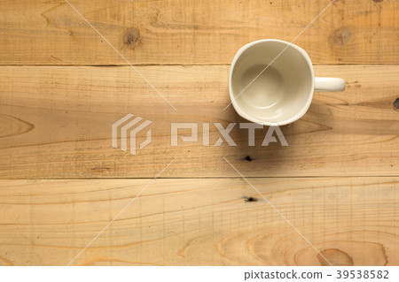 Cup on a wood table Cup on a wood table 39538582