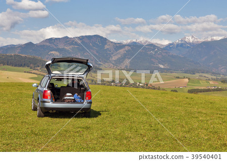 hatchback car on the top of the hill hatchback car on the top of the hill 39540401
