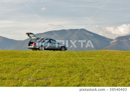 hatchback car on the top of the hill 39540403