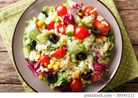 Tasty salad of fresh vegetables, rice and lettuce Tasty salad of fresh vegetables, rice and lettuce 39545111