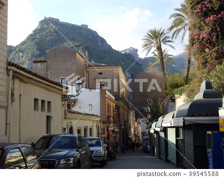 Near the entrance of the circular Greek theater in Taormina 39545588