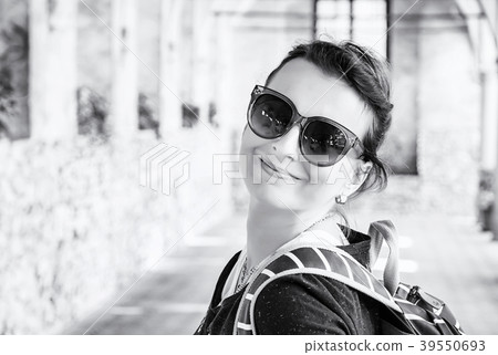 Joyful woman in medieval corridor, Telc, colorless Joyful woman in medieval corridor, Telc, colorless 39550693
