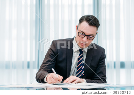 handsome successful business man working office handsome successful business man working office 39550713
