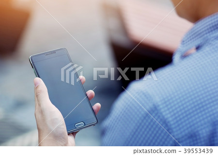 Handsome Business man in an using telephone glad Handsome Business man in an using telephone glad 39553439