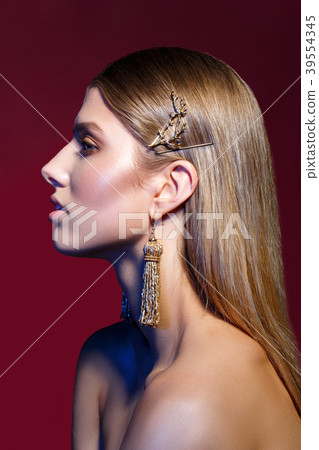 beautiful girl with long earrings 39554345