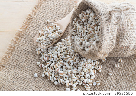 Millet on a hemp sack with wood Millet on a hemp sack with wood 39555599