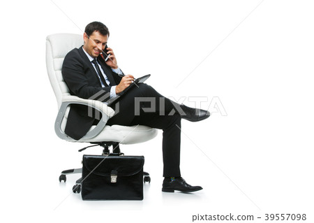 handsome businessman in suit sitting on armchair handsome businessman in suit sitting on armchair 39557098