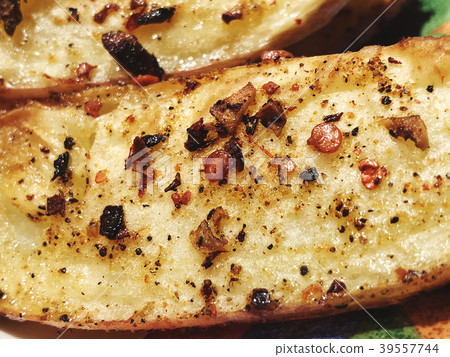 Tasty fried potato with spices. Rustic potato. Tasty fried potato with spices. Rustic potato. 39557744