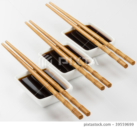 Three bowls of soy sauce on white background 39559699