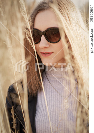 woman in dry grass woman in dry grass 39560694