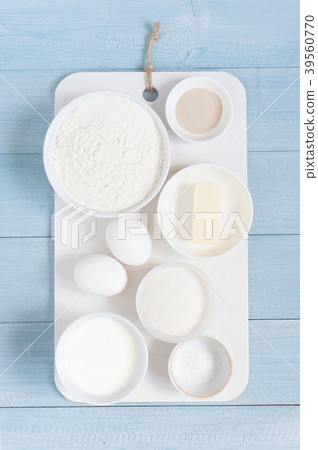 Ingredients for baking on the blue wooden table Ingredients for baking on the blue wooden table 39560770