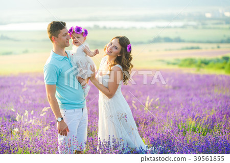 Young family in a lavender field Young family in a lavender field 39561855