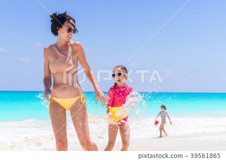 Mother with two kids enjoy beach vacation Mother with two kids enjoy beach vacation 39561865