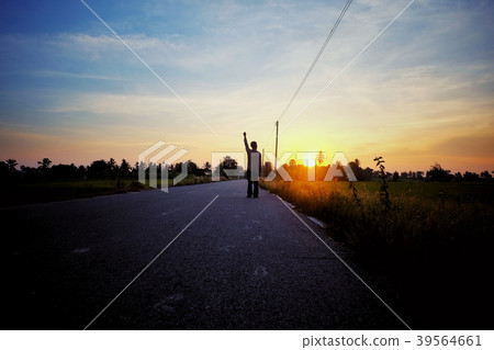 Man, power, and victory concept. Silhouette of a c 39564661