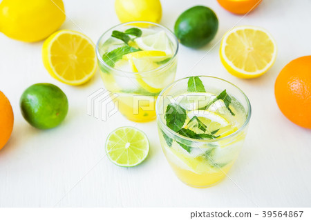 Citrus lemonade with limes, mint and lemons Citrus lemonade with limes, mint and lemons 39564867