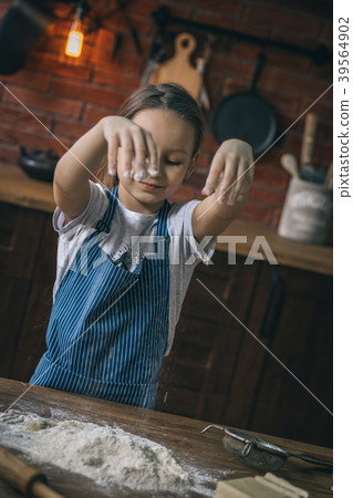 Girl cooking with flour Girl cooking with flour 39564902