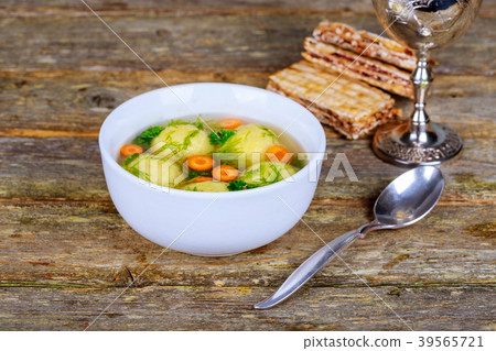 Delicious Matzoh ball soup with  wine  39565721