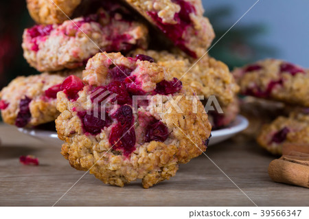Closeup of oatmeal cookies on plate on wooden background Closeup of oatmeal cookies on plate on wooden background 39566347