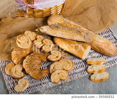 Various kinds of bread and bakery products on table Various kinds of bread and bakery products on table 39566832