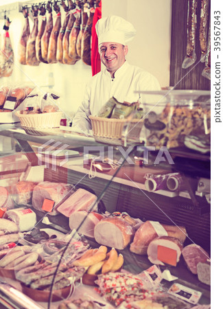 butcher with wurst at counter butcher with wurst at counter 39567843