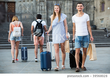 Couple walking through European city 39568028