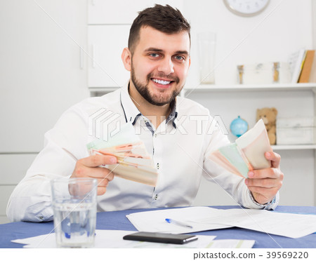 Male worker earning money effectively online 39569220