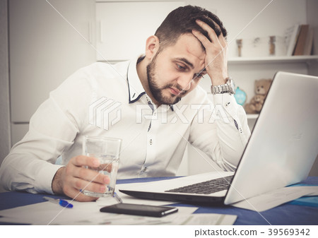 Man having problem in office Man having problem in office 39569342