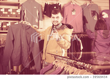 Couple deciding on track jacket 39569434