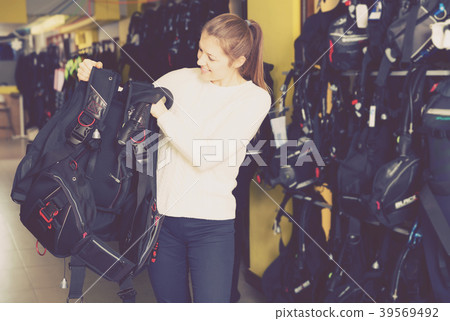 Sporty female is choosing new equipment for diving 39569492