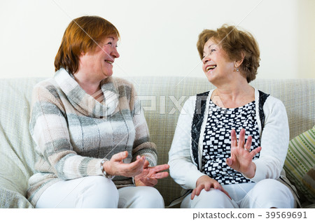 Happy senior women posing indoors and laughing 39569691