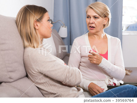 mother scolds her adult daughter mother scolds her adult daughter 39569764