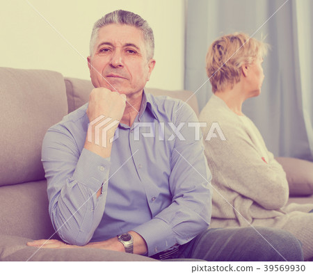 sad mature couple quarreling at home with each other sad mature couple quarreling at home with each other 39569930