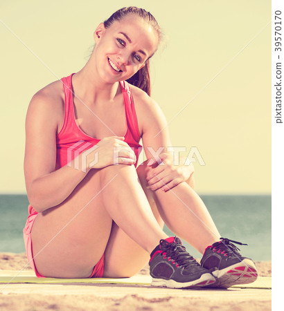 Happy young sporty woman exercising Happy young sporty woman exercising 39570170