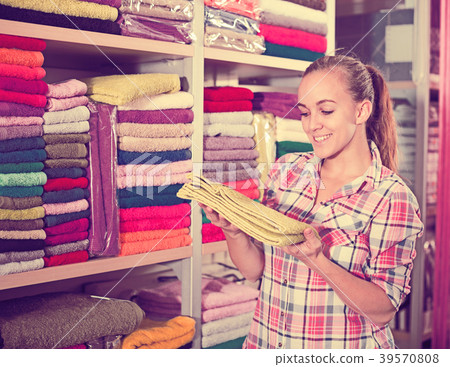 Woman choosing towels 39570808
